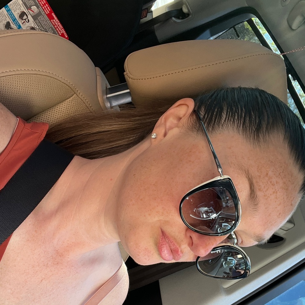 Prada Black Cat-Eye Sunglasses with Silver Temples